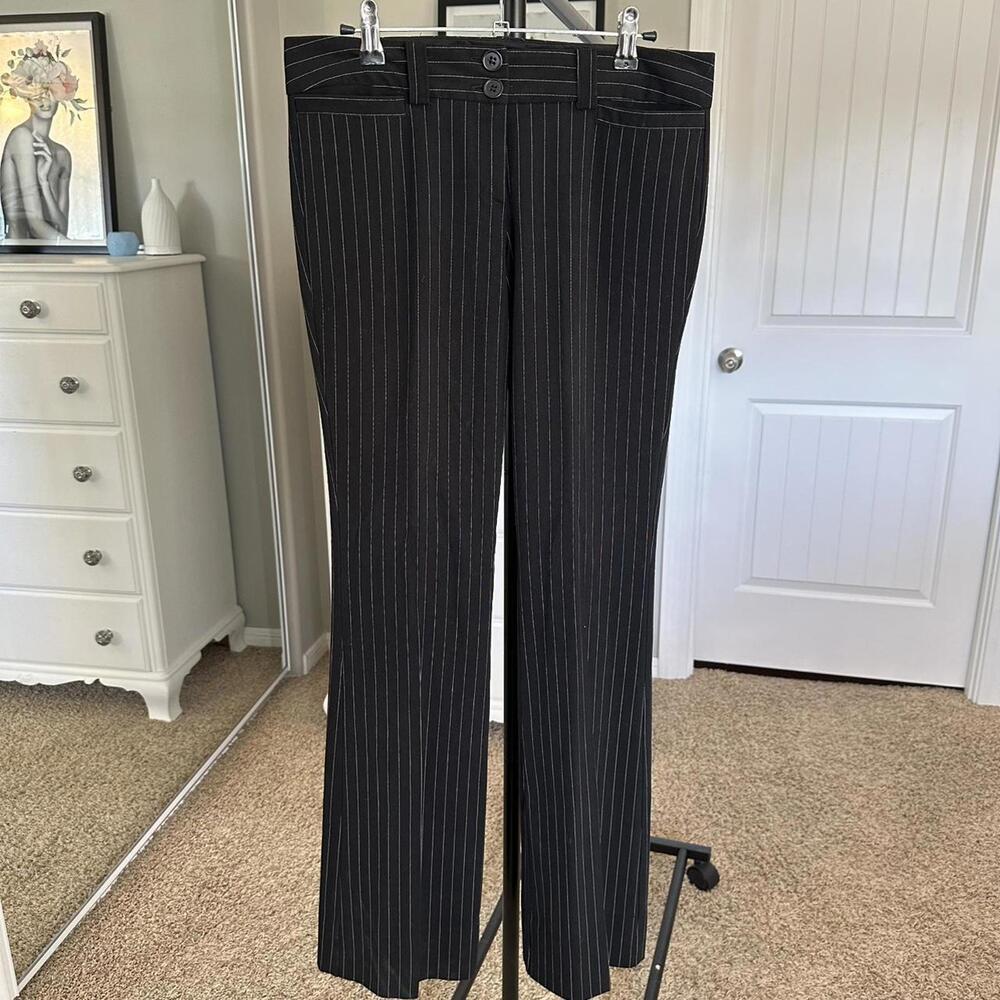 Black pinstripe straight leg trousers with a subtle pleat #workwear